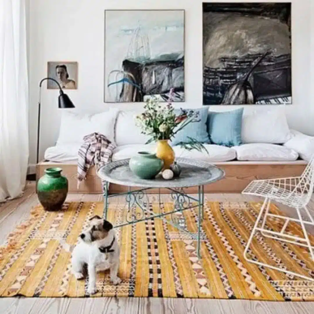 dog sitting on a patterned washable area rug in a stylish living room