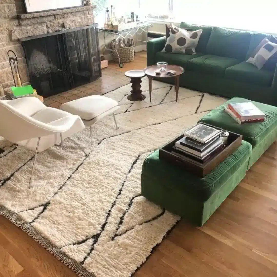 ivory Moroccan Berber washable rug with black geometric lines under green sofa in bright living room